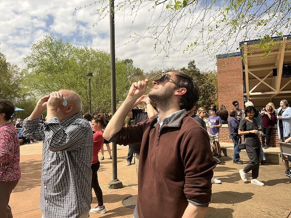 Astronomer Charles Law looks at the partial solar eclipse from the Chattanooga State Community College campus Monday. (Photo Courtesy of Shannon Coan)