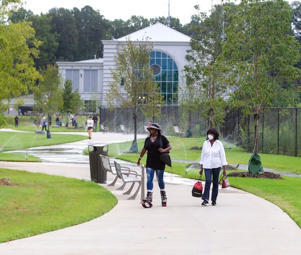 People walk around the grounds after the public opening of Atlanta's largest planned greenspace, Westside Park, Friday, August 20, 2021. STEVE SCHAEFER FOR THE ATLANTA JOURNAL-CONSTITUTION