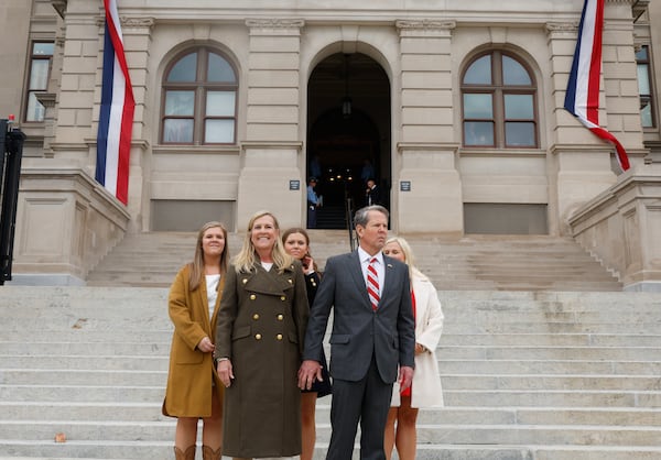 Gov. Brian Kemp, shown with his family following his inauguration earlier this month, has proposed income and property tax rebates, pay raises for teachers, increased school funding, worker training in the electric-vehicle industry and health insurance programs through his proposed state budget. (Natrice Miller/natrice.miller@ajc.com) 