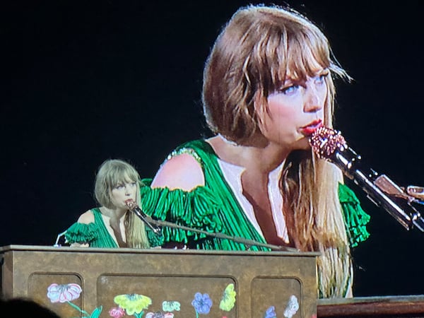 Taylor Swift singing "coney island" near the end of her concert at Mercedes-Benz Stadium in Atlanta April 28, 2023. RODNEY HO/rho@ajc.com