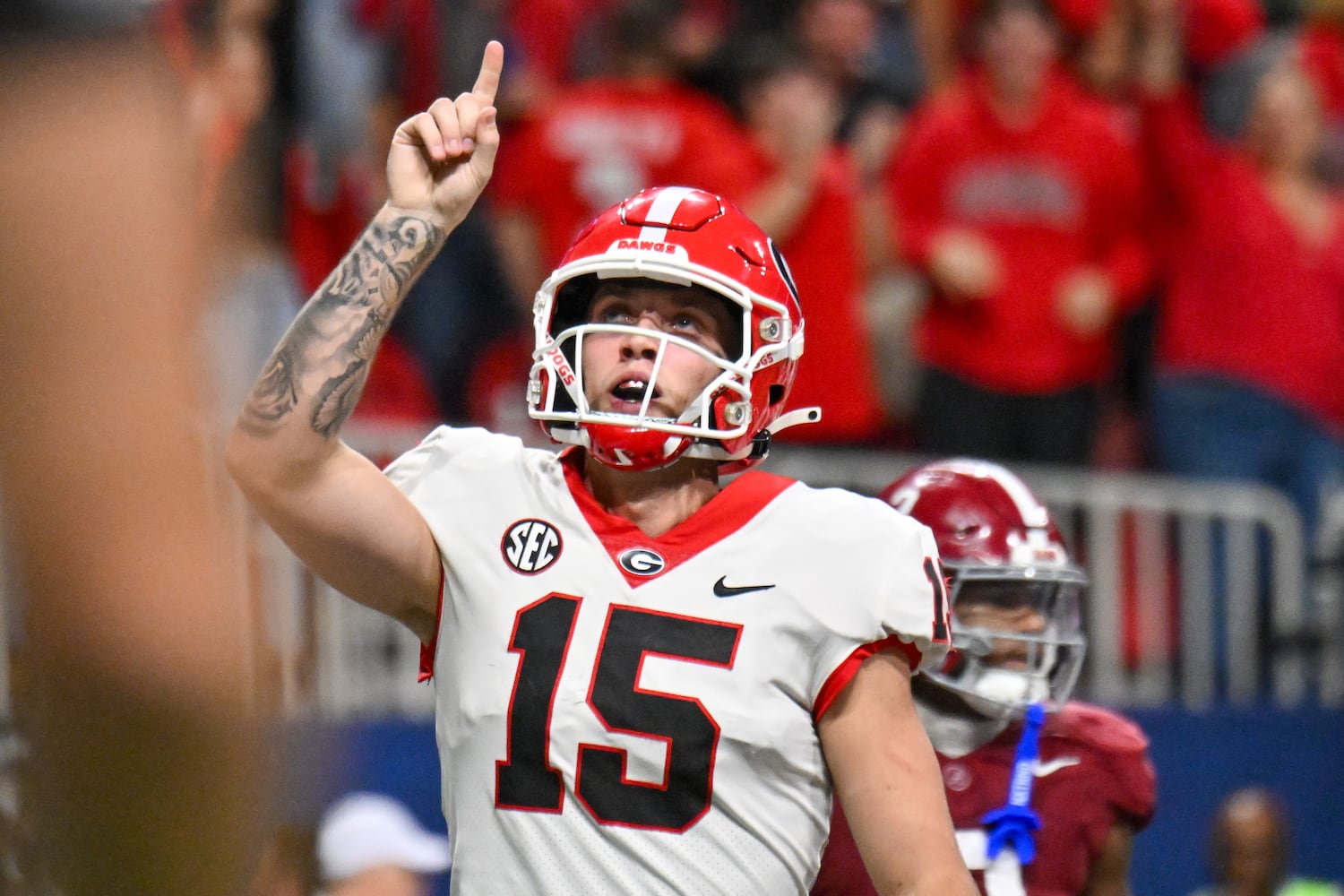 Georgia Bulldogs quarterback Carson Beck (15) celebrates a touchdown against the Alabama Crimson Tide on a 1 yard run during the second half of the SEC Championship football game at the Mercedes-Benz Stadium in Atlanta, on Saturday, December 2, 2023. (Hyosub Shin / Hyosub.Shin@ajc.com)