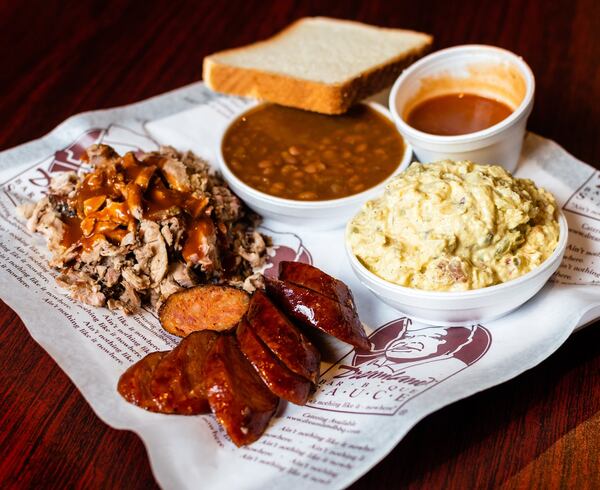 Dreamland’s combo plate of barbecued pork and smoked sausage at Parsons Alley. CONTRIBUTED BY HENRI HOLLIS