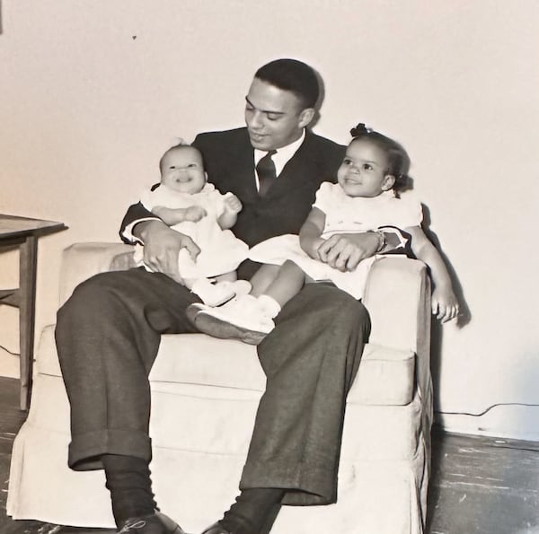 Andrew Young, the former mayor of Atlanta, sits with his daughters Andrea (left) and Lisa (right) in 1957. Lisa Young Alston died Friday, March 14, 2025. (Courtesy of the Young family)