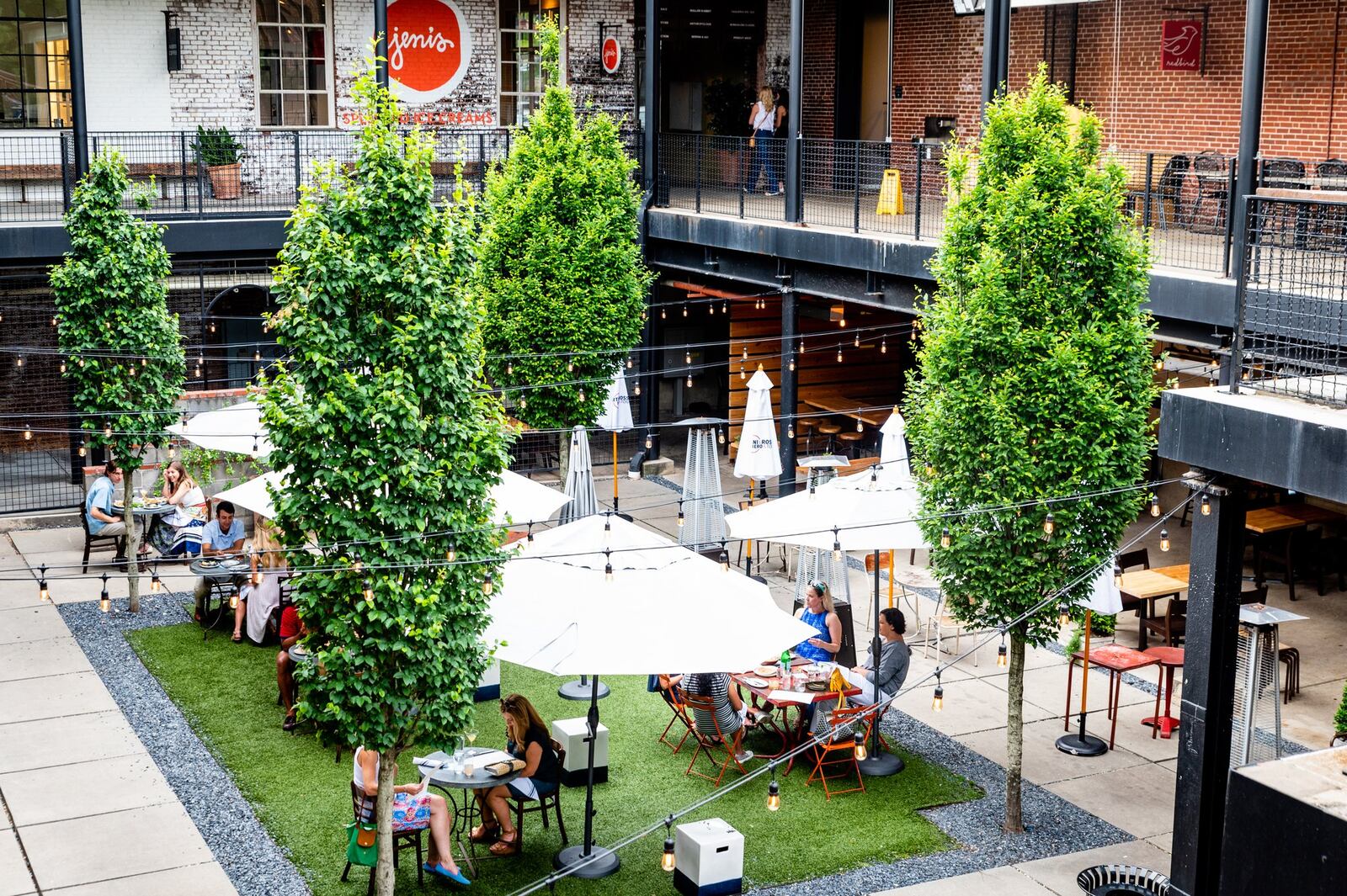 The courtyard at Westside Provisions District, where JCT Kitchen and Forza Storico both seat customers, has been arranged with socially distanced tables. CONTRIBUTED BY HENRI HOLLIS