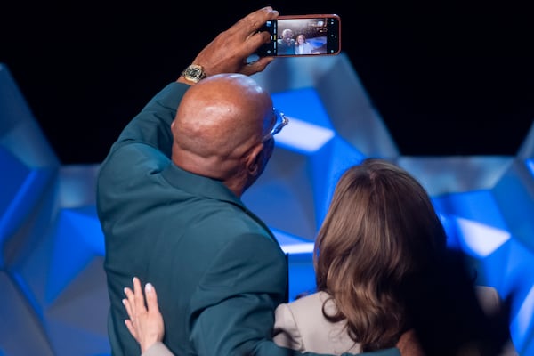 Comedian Steve Harvey and Vice President Kamala Harris take a selfie Friday after speaking at the 100 Black Men of America conference  in Atlanta. (Ben Gray / Ben@BenGray.com)