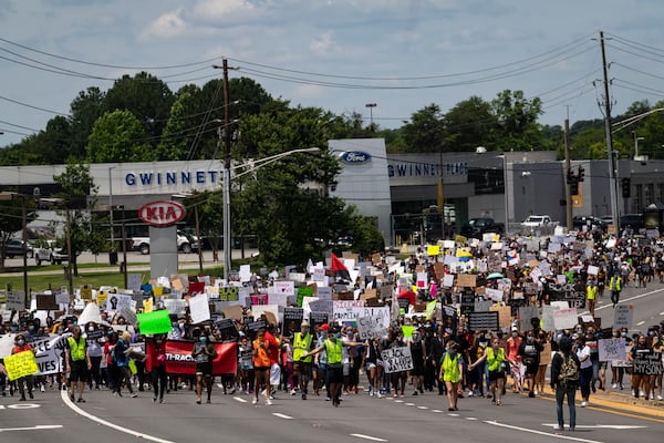 Demonstrators make their way down Satellite Boulevard. Protestors were demonstrating against the death of George Floyd at the knee of Minneapolis police.