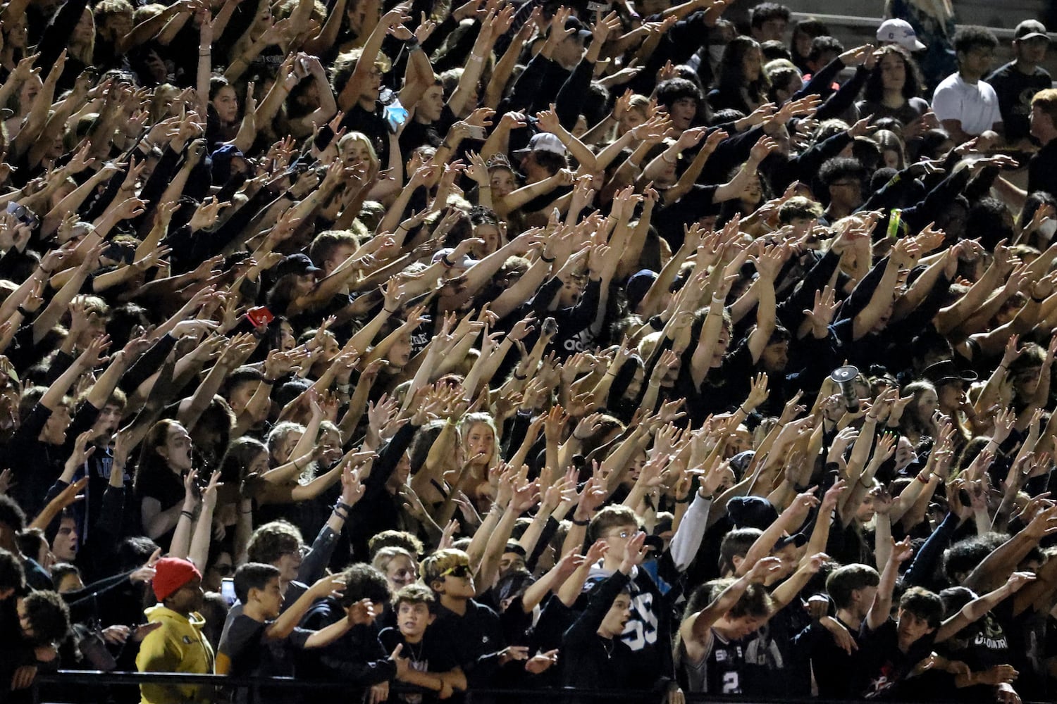 Sept. 24, 2021 - Johns Creek, Ga: Johns Creek students react during a kickoff after a touchdown by Johns Creek in the first half against Riverwood at Johns Creek high school Friday, September 24, 2021 in Johns Creek, Ga.. Johns Creek won 40-32. JASON GETZ FOR THE ATLANTA JOURNAL-CONSTITUTION