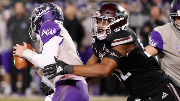 Mississippi State defensive end Kobe Jones (52) pressures Abilene Christian quarterback Luke Anthony (3) during the second half  Saturday, Nov. 23, 2019, in Starkville, Miss. Mississippi State won 45-7. (Rogelio V. Solis/AP)