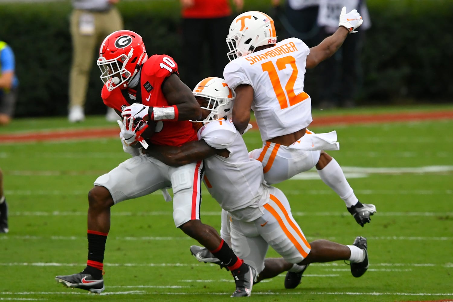 Georgia wide receiver Kearis Jackson (10) makes a catch as Tennessee defensive back Trevon Flowers (1) and defensive back Shawn Shamburger (12) defend during the first half of a football game Saturday, Oct. 10, 2020, at Sanford Stadium in Athens. JOHN AMIS FOR THE ATLANTA JOURNAL- CONSTITUTION