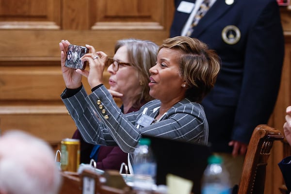 State Sen. Sonya Halpern, an Atlanta Democrat, takes a photo on Crossover Day at the Capitol in Atlanta. She is a guest today on the "Politically Georgia" podcast.