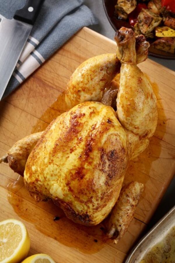 Roast chicken with paprika from "Simple: The Easiest Cookbook in the World" by Jean-Francois Mallet. As prepared in the Tribune test kitchen, the chicken took longer to bake, but tasters enjoyed the citrus and spices in the sauce. (Michael Tercha/Chicago Tribune/TNS)