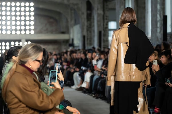 A model wears a creation as part of the Sacai Fall/Winter 2025-2026 Womenswear collection presented in Paris, Monday, March 10, 2025. (Photo by Scott A Garfitt/Invision/AP)