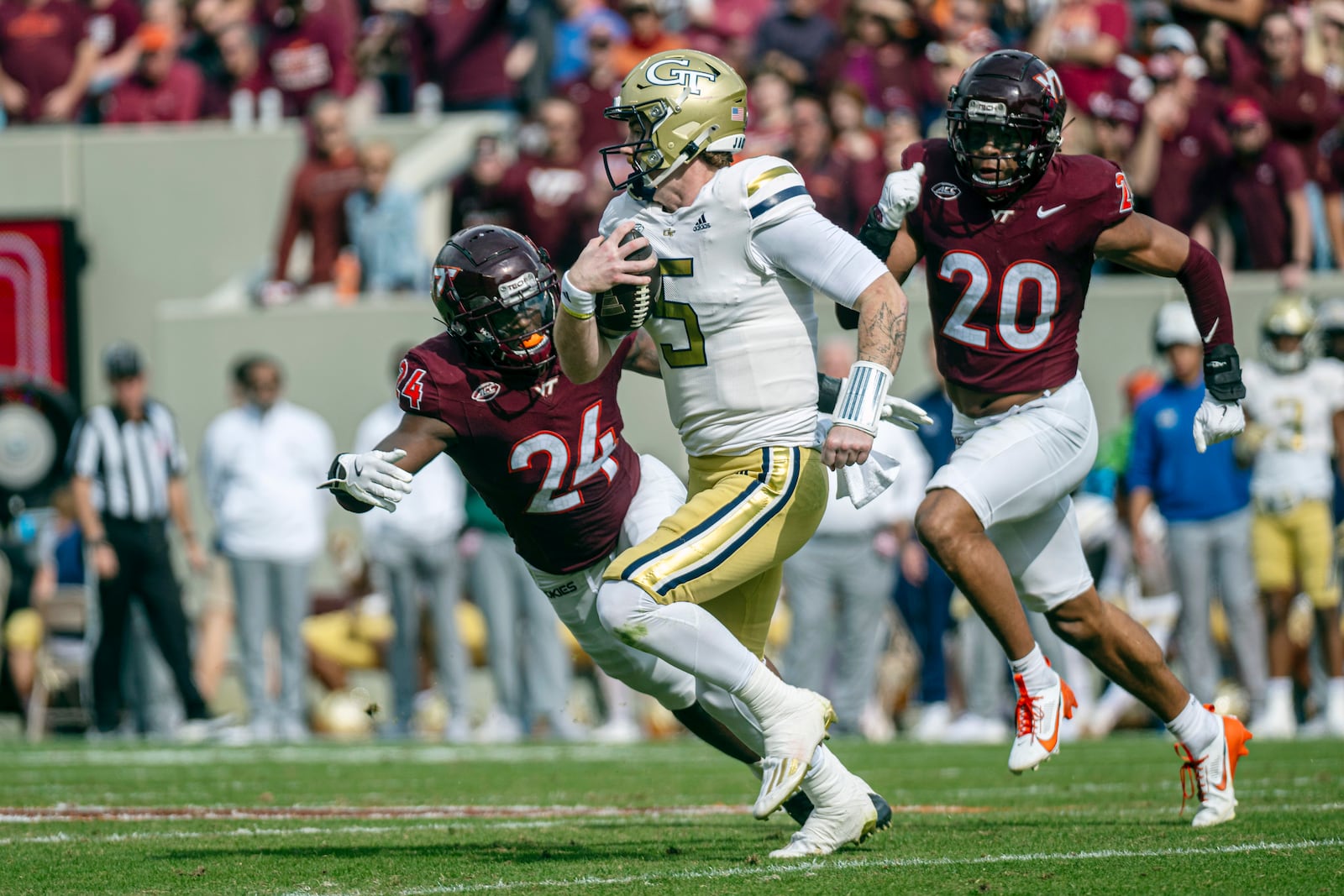 Georgia Tech's Zach Pyron runs the ball against Virgina Tech's Jaden Keller (24) during the second half of an NCAA college football game, Saturday, Oct. 26, 2024, in Blacksburg, Va. (AP Photo/Robert Simmons)