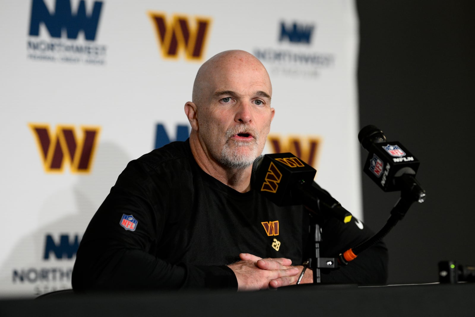 Washington Commanders head coach Dan Quinn speaks during a news conference after an NFL football game against the Carolina Panthers, Sunday, Oct. 20, 2024, in Landover, Md. The Commanders 40-7. (AP Photo/Nick Wass)