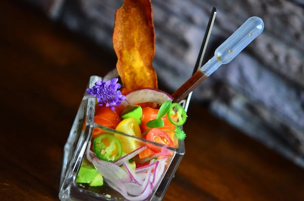 Ceviche with ocean trout, tomatoes, sweet red onion, avocado and yuzu dressing. (Eight Sushi Lounge)