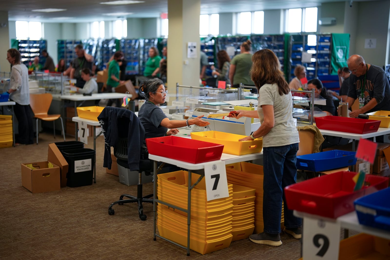 Election workers process mail-in ballots for the 2024 General Election at the Chester County, Pa., administrative offices, Tuesday, Nov. 5, 2024, in West Chester, Pa. (AP Photo/Matt Slocum)