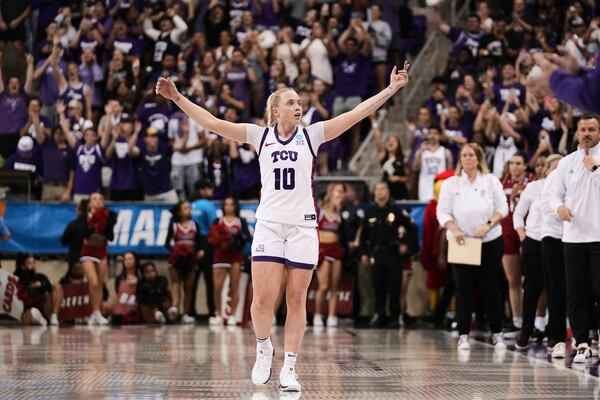 TCU's Hailey Van Lith celebrates in the closing seconds of the team's win against Louisville in the second round of the NCAA college basketball tournament in Fort Worth, Texas, Sunday, March 23, 2025. (AP Photo/Tony Gutierrez)