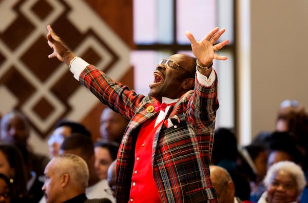 Cail Merrell, otherwise known as "The Happy Preacher," shouts out during during the Rev. Martin Luther King Jr. holiday commemorative service at Ebenezer Baptist Church where King preached, Monday, Jan. 18, 2016, in Atlanta. (AP Photo/David Goldman)