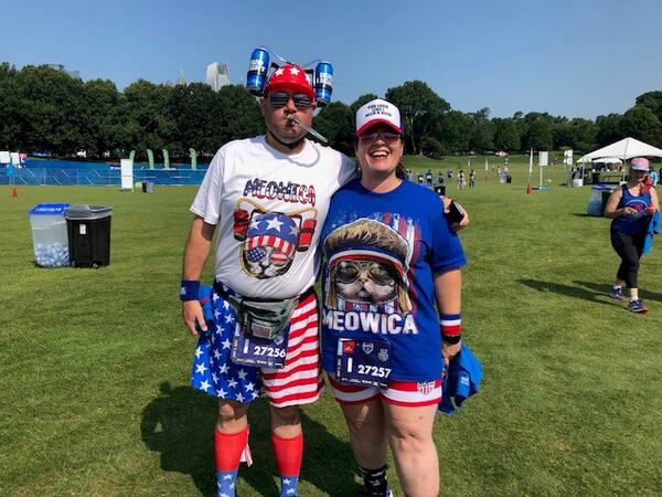 Atlanta Journal-Constitution Peachtree Road Race participants Matt and Gloria (they did not share their last names) pose for a photo in Piedmont Park July 3, 2021 after finishing their race. (AJC photo by Ken Sugiura)