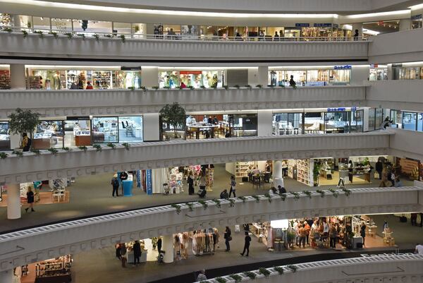 Shop owners and retail buyers roam Building 3 of AmericasMart in downtown Atlanta on Wednesday. Buyers use the annual January Atlanta Market to visit wholesalers and stock up on everything from patio furniture to home decor for the coming year. This year's crowd is smaller than normal because of the coronavirus.  (Hyosub Shin / Hyosub.Shin@ajc.com)