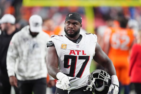 Atlanta Falcons defensive end Grady Jarrett heads off the field after an NFL football game against the Denver Broncos, Sunday, Nov. 17, 2024, in Denver. (AP Photo/David Zalubowski)