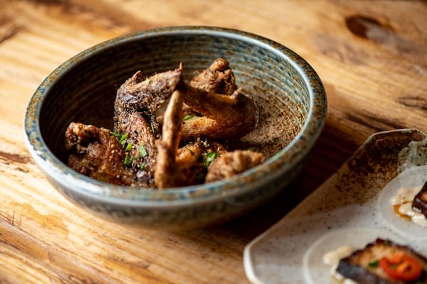 Tebasaki fried wings with garlic soy sauce, sesame seeds, and chives. Photo credit- Mia Yakel.