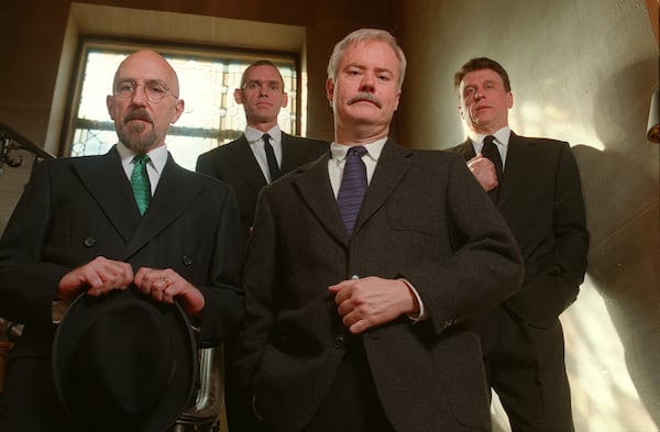 The four artists who call themselves Taboo pose for a funeral portrait to signify the end of their collaboration on January 5, 1999. They are King Thackston (from left), Michael A. Venezia, David Fraley, and Larry Jens Anderson. (DAVID TULIS/Staff)