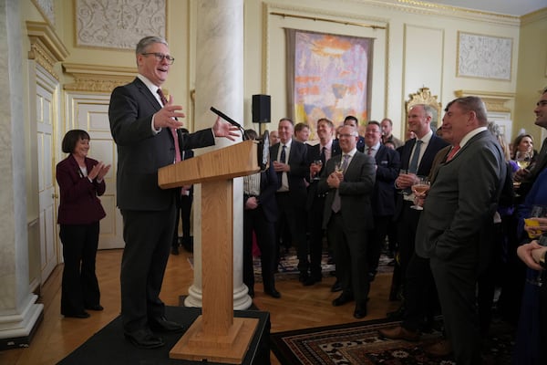 Britain's Prime Minister Keir Starmer, left gestures as he speaks to guests as they as attend a St David's Day reception inside 10 Downing Street in London Monday, March 3, 2025. (AP Photo/Kin Cheung, Pool)