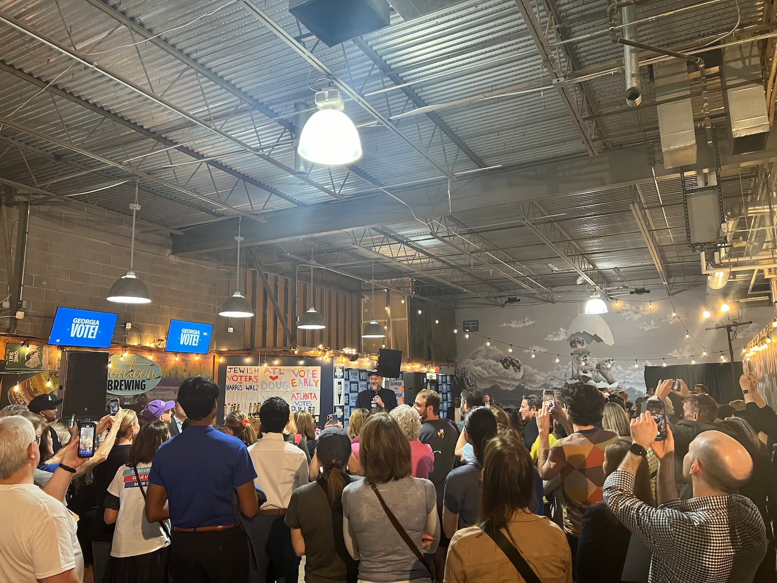 Doug Emhoff speaks to a crowd of Georgia voters at the Pontoon Brewing Company in Sandy Springs on October 27, 2024.