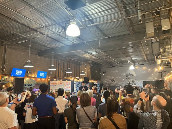 Doug Emhoff speaks to a crowd of Georgia voters at the Pontoon Brewing Company in Sandy Springs on October 27, 2024.