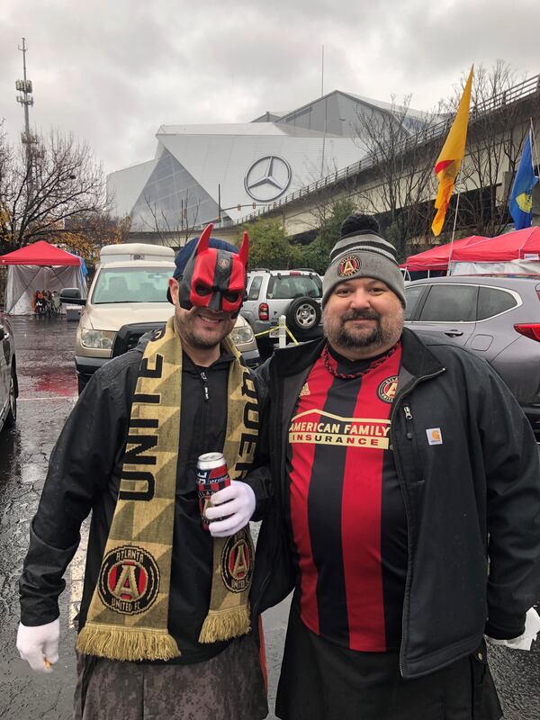 Justin Nelson and Bobby Cartwright hang out at the Gulch to tailgate before Atlanta United's game on Saturday, Dec. 8, 2018. (Photo: Carrie Teegardin/AJC)