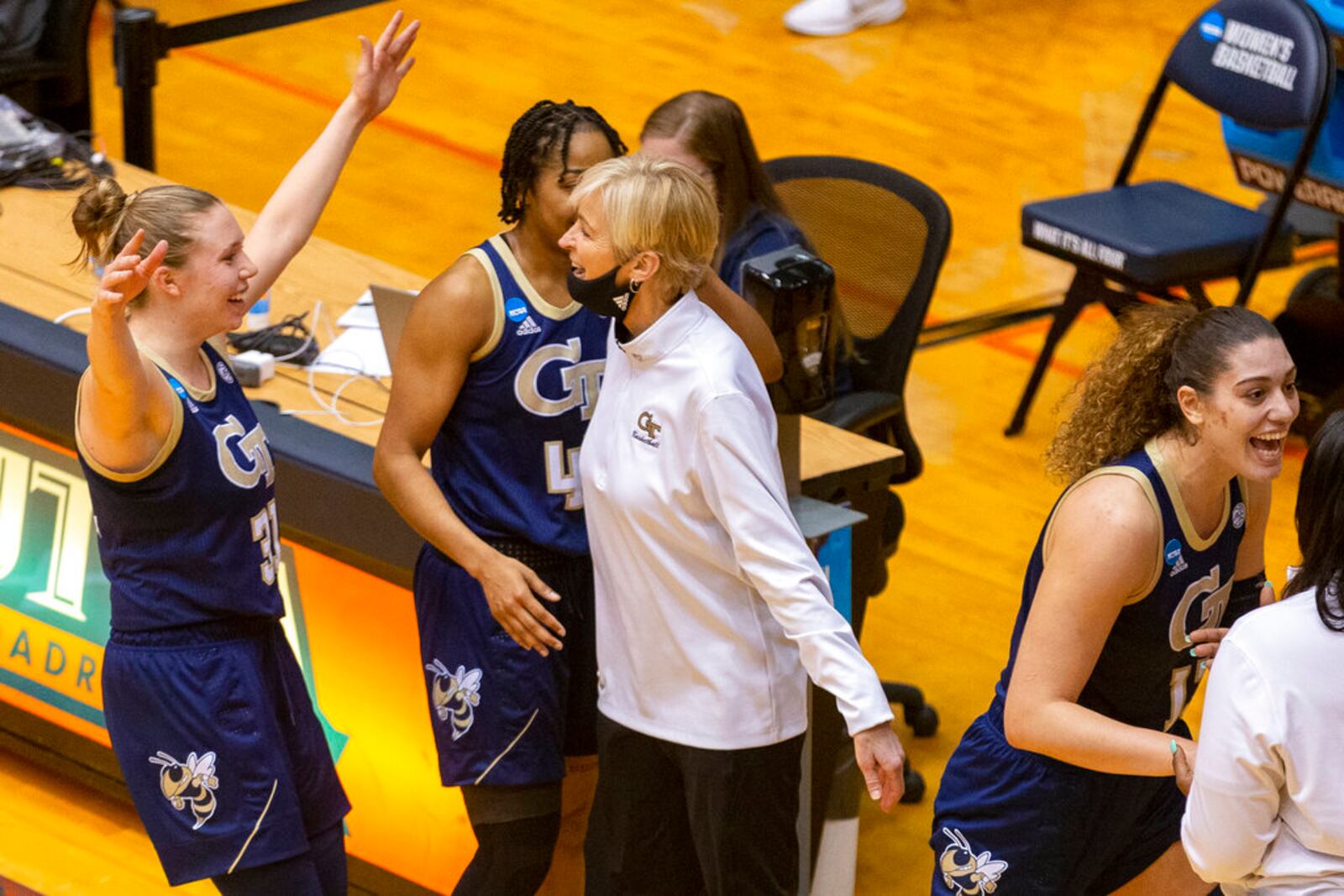 Georgia Tech coach Nell Fortner, center, celebrates the team's 73-56 win over West Virginia with guard Lotta-Maj Lahtinen, left, guard Kierra Fletcher and forward Lorela Cubaj, right, in an college basketball game in the second round of the NCAA women's tournament at the UTSA Convocation Center in San Antonio on Tuesday, March 23, 2021. (AP Photo/Stephen Spillman)