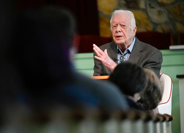 In this Nov. 3, 2019, file photo, former President Jimmy Carter teaches Sunday school at Maranatha Baptist Church, in Plains, Ga. Former President Carter called Wednesday, June 3, 2020, for Americans in positions of power and influence to fight racial injustice, saying “silence can be as deadly as violence.”