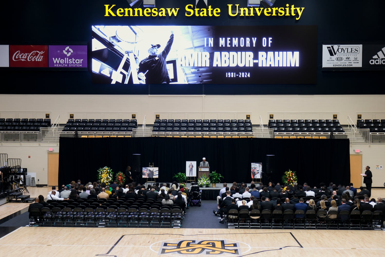 Imam Lemon El-Amin says a prayer to open a celebration of life for former Kennesaw State University basketball coach Amir Abdur-Rahim at the KSU convocation center on Sunday, Oct. 27, 2024.   Ben Gray for the Atlanta Journal-Constitution