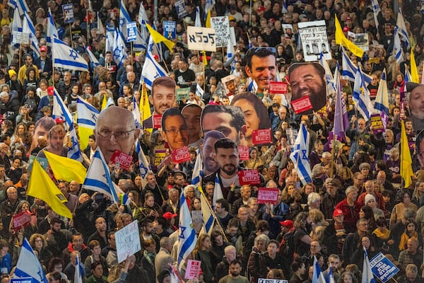 People take part in a protest in Tel Aviv, Israel, Saturday, March 8, 2025, demanding the immediate release of hostages held by Hamas in the Gaza Strip. (AP Photo/Ariel Schalit)