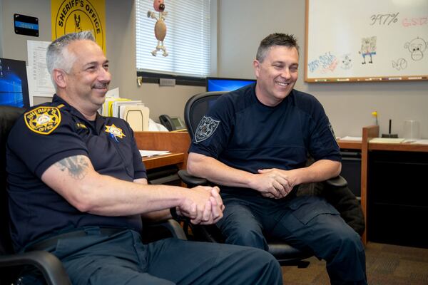 Lt. Paul Corso (L) and Master Deputy Jason Cotton talk about being on “Live PD” at the Gwinnett County Sheriff’s Office headquarters May 9, 2019. STEVE SCHAEFER / SPECIAL TO THE AJC