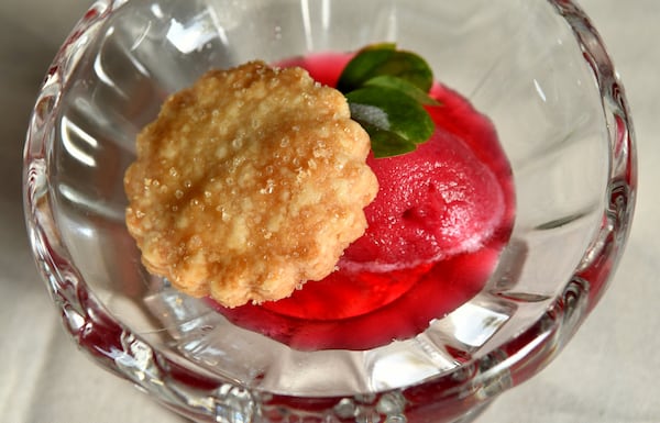 The first course of A Dinner at 29 was shortbread cookie served with hibiscus scotch bonnet sorbet.  (CHRIS HUNT FOR THE ATLANTA JOURNAL-CONSTITUTION)