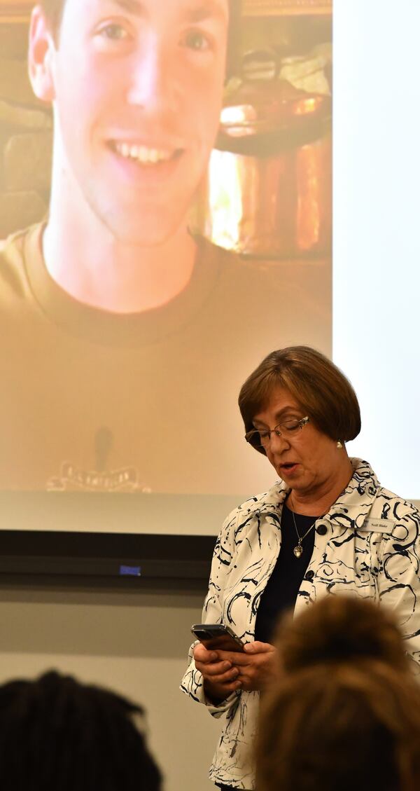 220711 Austell, Ga.: Neill Blake reads the suicide note to attendees from her son David (pictured), who died in 2018. Profile of Neill Blake, mental health advocate and Program Director and Past President for NAMI (National Alliance on Mental Illness) Cobb. Blake is giving mental health training at the Cobb County Police Department and Public Safety Building in Austell, Ga. on Monday, July 11, 2022. A large part of Neill’s presentation for the multi-jurisdiction audience revolves around her personal experience dealing with her son David, who committed suicide in 2018. Neill talks about the realities of living with a loved one with mental illness, the pain, the hardships, and the sometimes tragic outcome. Neill read her son’s long and heartfelt suicide note to the officers and professionals attending the presentation. For Aging in Atlanta feature AAJC008072022COMMUNITYPROFILEAIA. (CHRIS HUNT FOR THE ATLANTA JOURNAL-CONSTITUTION)