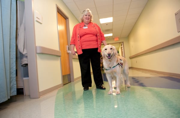 Lisa Kinsel launched Canine for Kids with one dog, Casper, who served the hospital for nine years before retiring in 2018. He died in 2022. (Contributed)