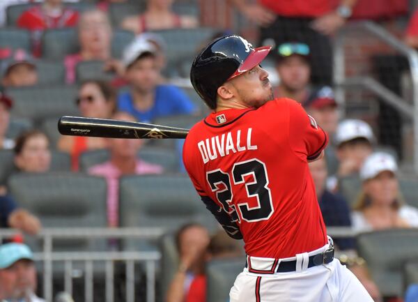 Braves left fielder Adam Duvall (23) hits a two-run home run in the seventh inning against the St. Louis Cardinals during Game 2 of the National League Division Series at SunTrust Park on Friday, October 4, 2019. (Hyosub Shin / Hyosub.Shin@ajc.com)