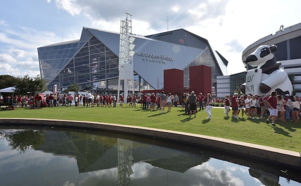 September 2, 2017 Atlanta - Fans tailgate outside the Mercedes-Benz Stadium before the 2017 Chick-Fil-A Kickoff game between Alabama and Florida State on Saturday, September 2, 2017. HYOSUB SHIN / HSHIN@AJC.COM