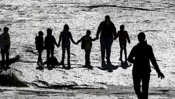 Children from Pleasant Hill Academy in Gwinnett County join hands during their spring break outing on the trail to the top of Stone Mountain on Tuesday.