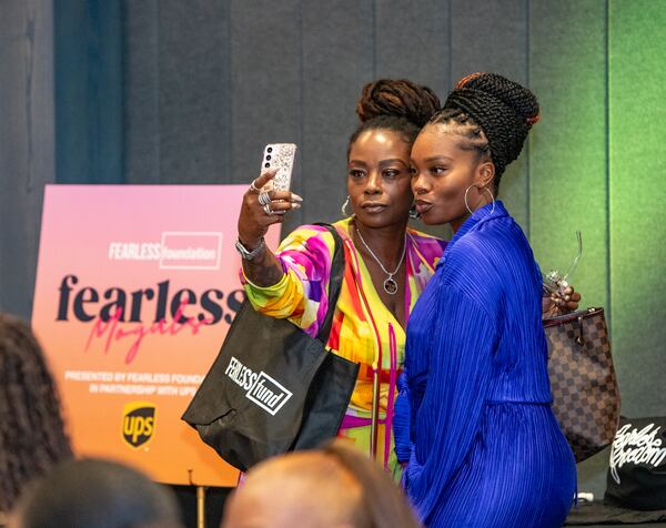 Sutonya Lopez, left, and Brandashia Thurman, right, attend the Fearless Moguls event at The Gathering Spot ATL on Friday, Aug 30, 2024 for women of color entrepreneurs.  This is day one of a multi-day conference which provides networking and opportunity for Black women business owners. (Jenni Girtman for The Atlanta Journal-Constitution)