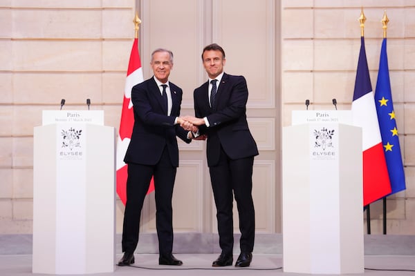 Canada Prime Minister Mark Carney, left, and President of France Emmanuel Macron shake hands after delivering a joint statement at the Palais de l'Elysee in Paris, on Monday, March 17, 2025. (Sean Kilpatrick/The Canadian Press via AP)