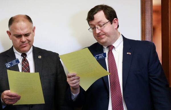 RESOLUTION READING--Then-Sen. Josh McKoon and his colleague Bruce Thompson review a draft of "religious liberty" legislation in 2016. Thompson is now the state's labor commissioner. BOB ANDRES / BANDRES@AJC.COM