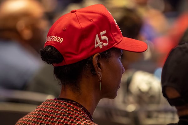 09/25/2020 - Atlanta, Georgia - A President Trump supporter listens to individuals speak during a Blacks for Trump campaign rally at the Cobb Galleria Centre in Atlanta, Friday, September 25, 2020.  (Alyssa Pointer / Alyssa.Pointer@ajc.com)