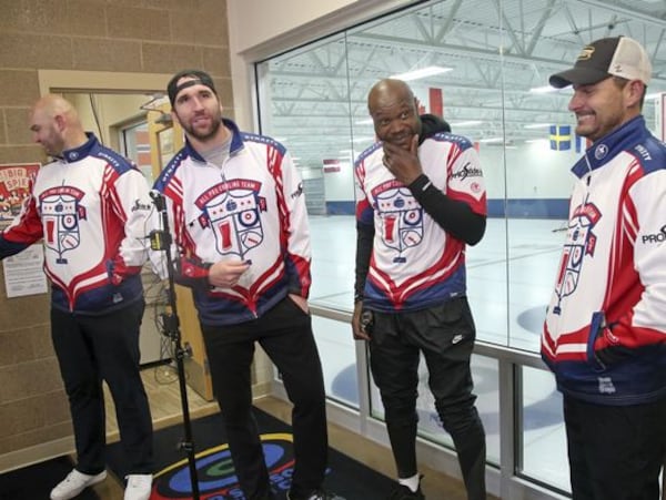 In this Jan. 3, 2019 photo, former Minnesota Vikings football player Jared Allen, second from left, stands with his three curling teammates, from left, Michael Roos, Keith Bullock and Marc Bulger, after practice for a competition in Blaine, Minn.