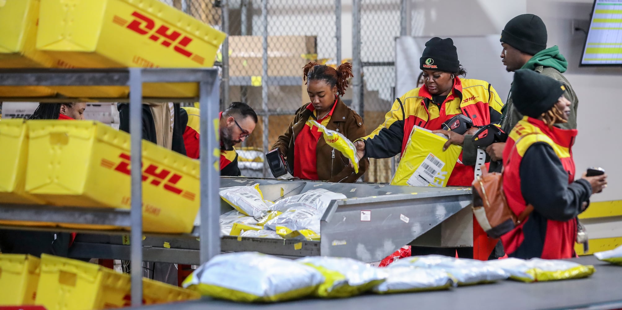 December 15, 2022 ATLANTA: Sorting out the packages and readying them for transport.  (John Spink / John.Spink@ajc.com)

