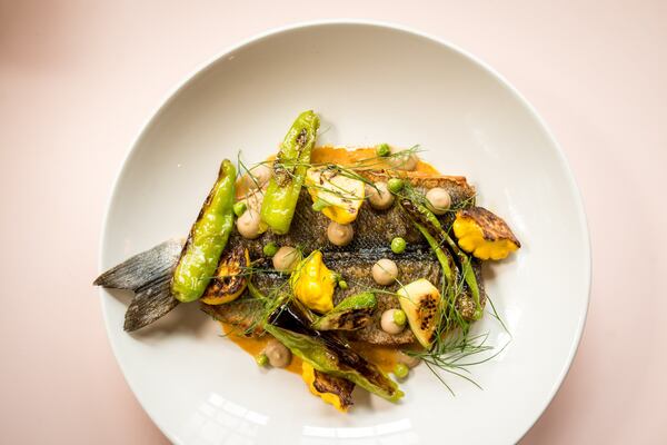  Whole Roasted Loup De Mer with eggplant cari, shishito, english peas, shaved radish, and harissa beurre monte. Photo credit- Mia Yakel.