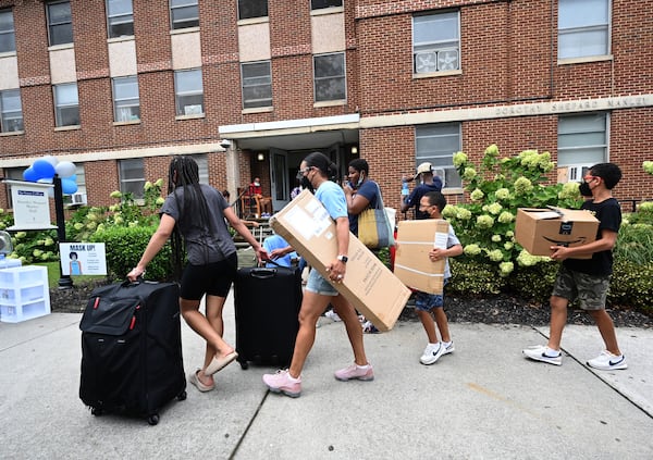 Incoming students and family members move items into Dorothy Shepard Manley Hall, one of dorms for freshman students, at Spelman College on Wednesday, August 10, 2022. (Hyosub Shin / Hyosub.Shin@ajc.com)